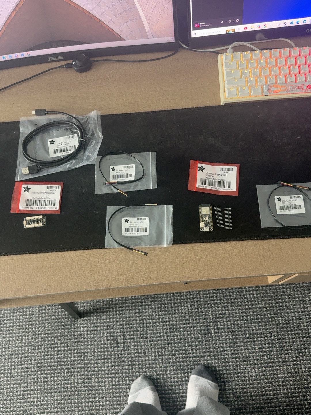 Early Palera prototype electronics including an ESP32-S3 Feather and I2C multiplexer